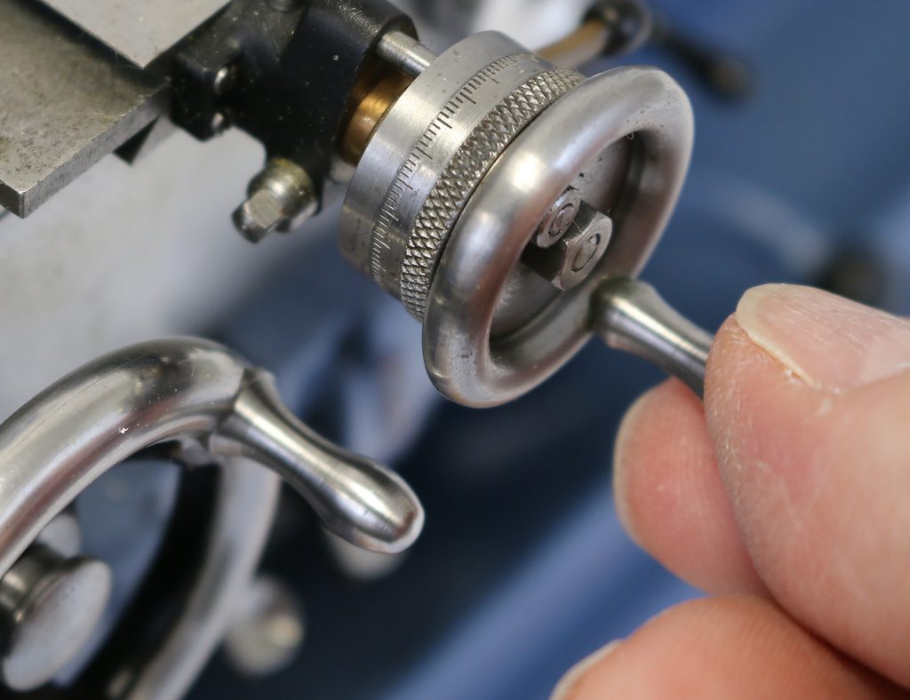 A closer look at some of the tiny hand wheels.