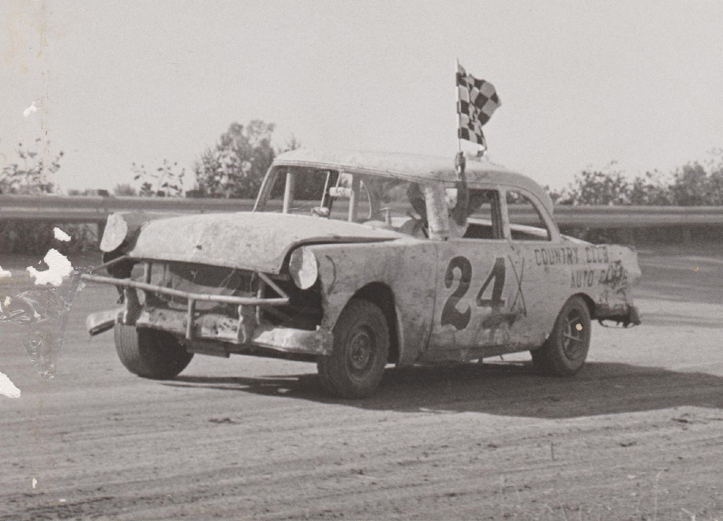 Ernie Racing a Stock Car Ernie takes a victory lap in his Ford stock car.