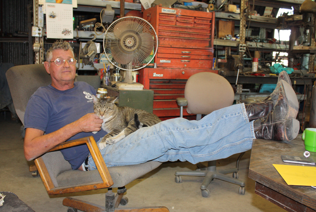 Ernie With His Cat Ernie and his cat kicking back in the shop.