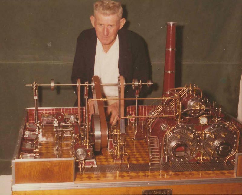John Posing With a Model John posing with his steam powered machine shop model.