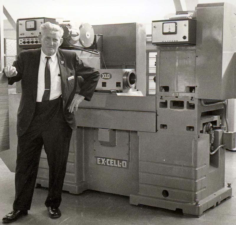 John Aschauer With Machine John with one of the machines at Ex-Cell-O.