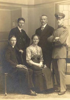 Aschauer Family Portrait John standing at left in a family photo.