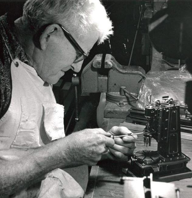 John Aschauer John Aschauer working on a miniature machine tool model.
