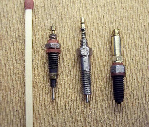 Miniature Injectors Miniature injectors with a match for scale reference.