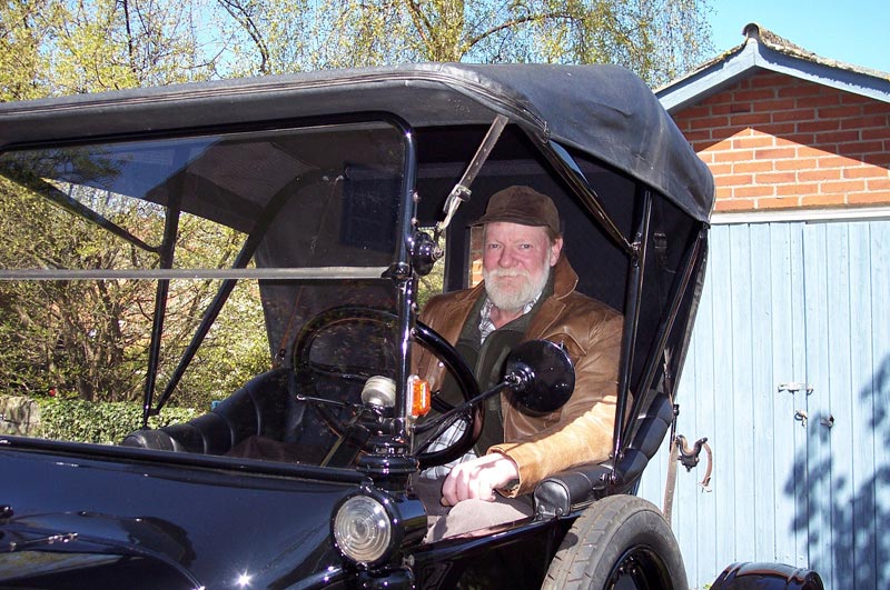 Find Hansen With His Restored Model T Find sits in the driver's seat of his restored Model T.