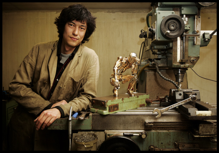 Mark Ho With His Sculpture Mark Ho with his animatronic metal sculpture.