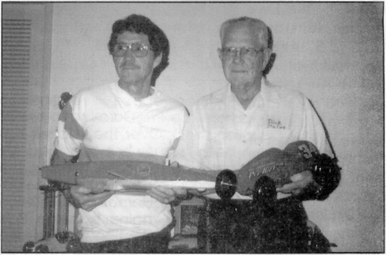 Harold and Dick McCoy Dick McCoy (right) and his son, Harold display two original McCoy race cars.