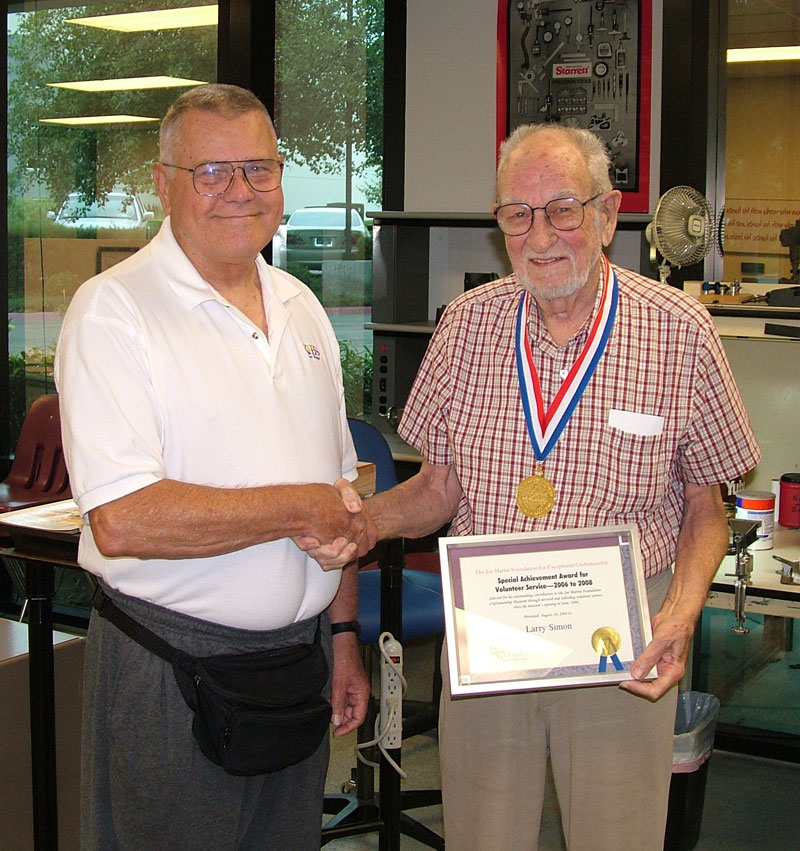 Joe Martin and Larry Simon Joe Martin (left) presented Larry with a special recognition award for his volunteer work.