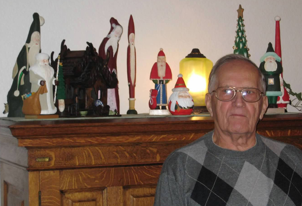 Sheridan Preston Sheridan Preston with some of his carved wooden Santa figures.