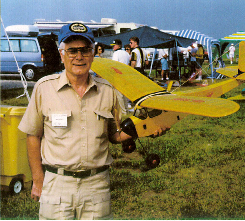 Gerhard With His R/C Viking Airplane Gerhard holding his silk-covered vintage Viking RC airplane.