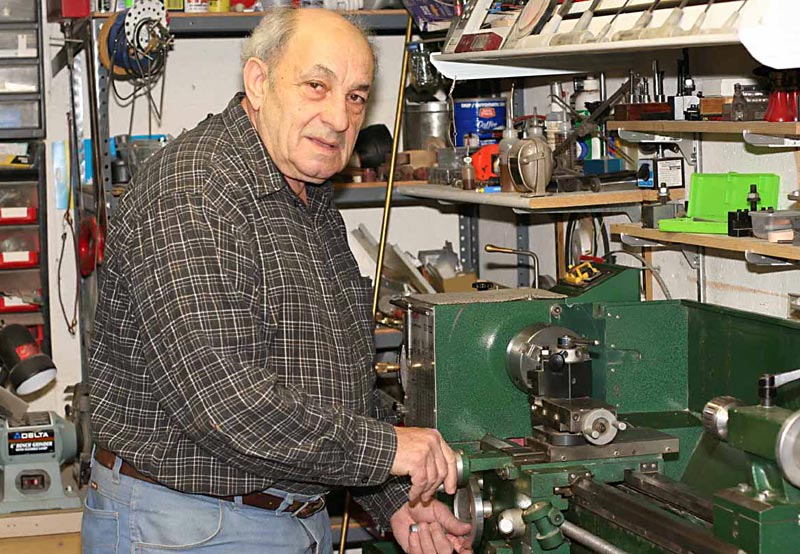Sunia Reznik in His Shop Sunia Reznik at work on the lathe in his home shop.
