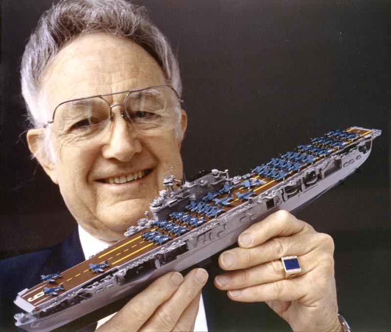 William Tompkins With One of His Ships William Tompkins displaying one of 307 model ships in his fleet.