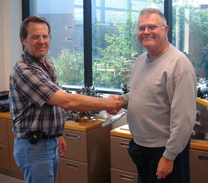 Paul Knapp With Joe Martin Paul Knapp (left) shakes hands with museum founder Joe Martin.