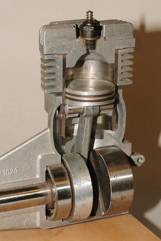An older HP .61 single-cylinder cutaway. (No number, unpainted, rear intake.)