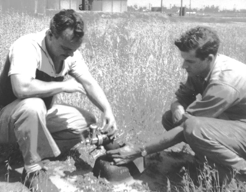 Henry Orwick Test Running an Engine Henry Orwick (left) test running one of his engines with the help of friend Tom Strom.