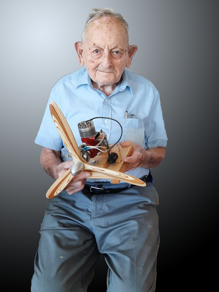 George Genevro is pictured with his last Titan .60 engine. The three-bladed propeller was hand-carved by George.
