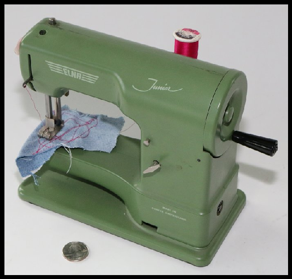 This Elna Junior is a working miniature travel sewing machine that was made in Switzerland.