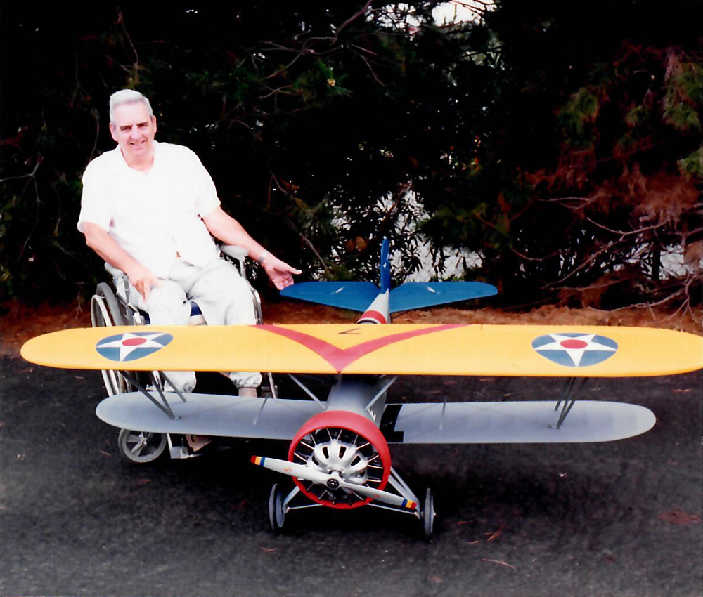 Dan With His F4B-2 Biplane Mr. Lutz posed behind his impressive R/C scale model of the F4B-2 biplane.