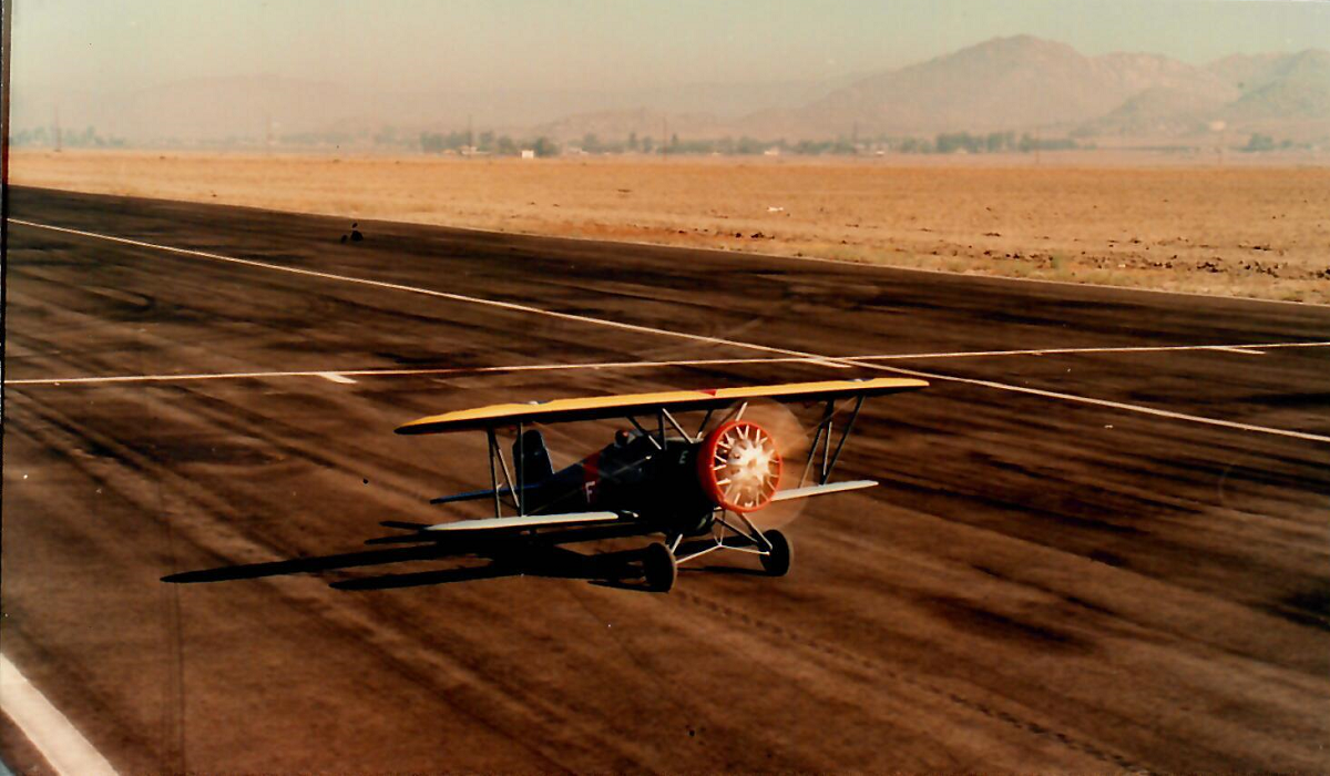 F4B-2 Biplane Dan's F4B-2 biplane sits on the runway with prop spinning, ready to soar into the sky.