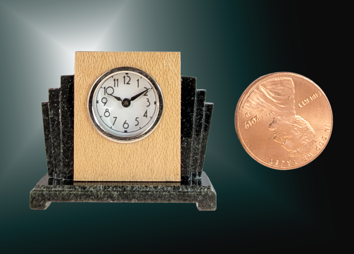 Art Deco Clock A miniature Art Deco Clock. Materials: Steatite (soapstone) body and base, maple veneer, nickel plated brass glass ring and back cover, glass. 1.25x1.1x.4