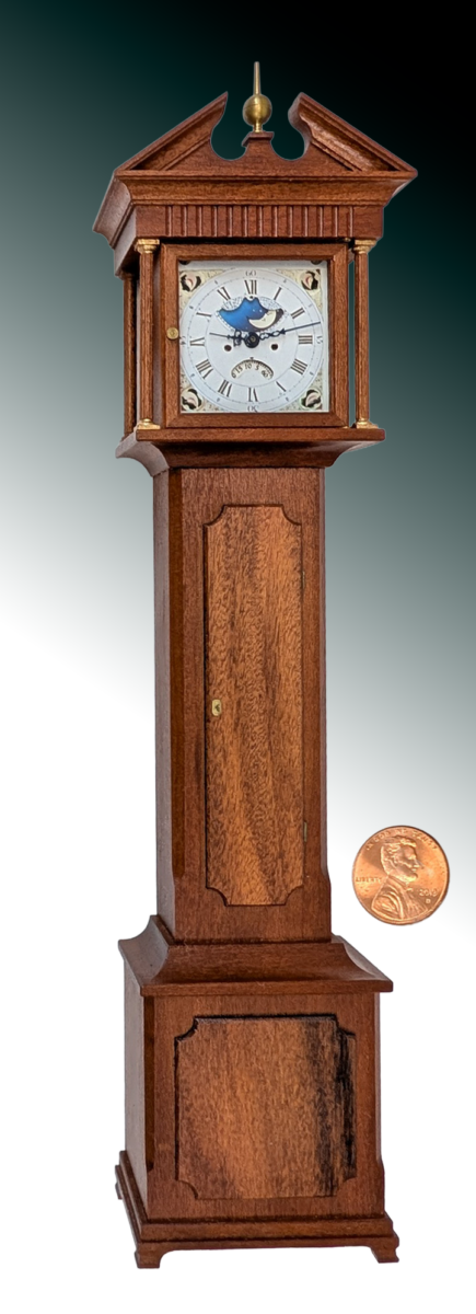 Tall Case Clock (Grandfather) Tall Case Clock (Grandfather). Materials: Stained Cherry and Rosewood case, brass dial plate, finial, lock plate/key and hinges, glass. 1.75x8x1.2